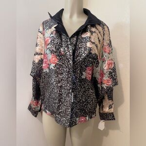 Lightweight, reversible unisex jacket, new with tag.